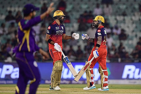 Royal Challengers Bengaluru's Virat Kohli, right, fist bumps his batting partner Devdutt Padikkal during the Indian Premier League cricket match between Royal Challengers Bengaluru and Kolkata Knight Riders in Raipur, India, Wednesday, May 13, 2026. (A)