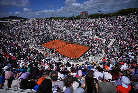 Fans watch as Italy's Jannik Sinner plays Italy's Andrea Pellegrino, during their match at the Italian Open tennis tournament in Rome.
