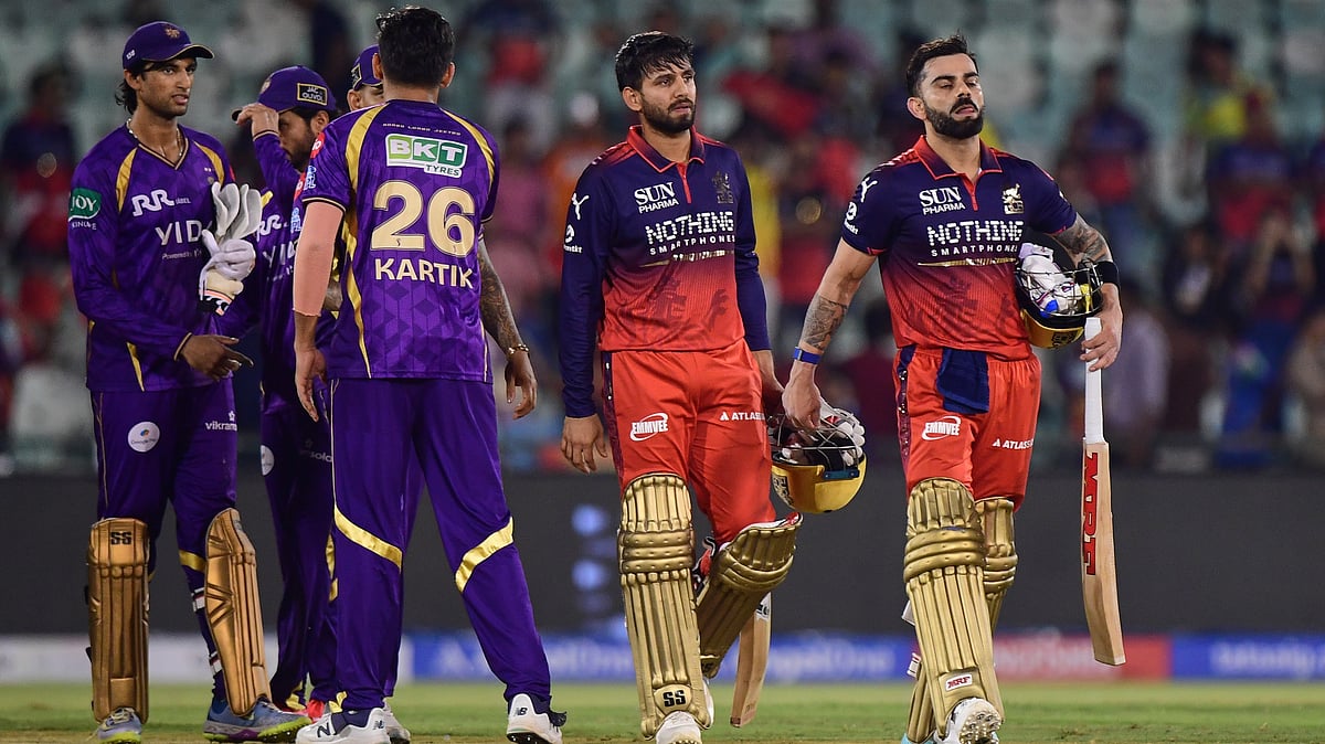 Royal Challengers Bengaluru's Virat Kohli, right, and batting partner Jitesh Sharma leave the field after winning the Indian Premier League cricket match between Kolkata Knight Riders and Royal Challengers Bengaluru in Raipur, India, Wednesday, May 13, 2026 - (AP Photo/Abhijit Addya)