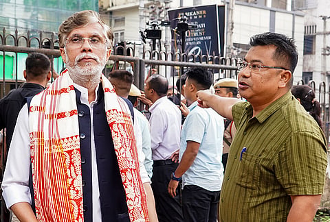 Congress leader Pawan Khera, left, appears before the Assam Crime Branch in connection with the defamation case filed by Riniki Bhuyan Sharma, wife of Assam Chief Minister Himanta Biswa Sarma, in Guwahati.