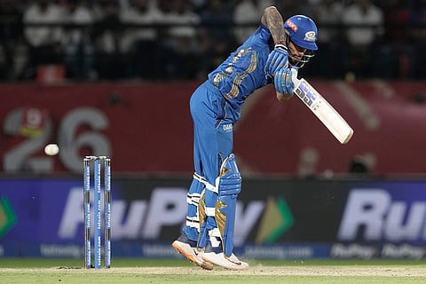 Mumbai Indians' Tilak Varma bats during the Indian Premier League cricket match between Punjab Kings and Mumbai Indians in Dharamshala, India.