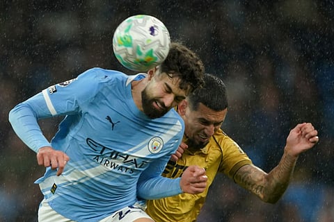 Crystal Palace's Daniel Munoz, right, and Manchester City's Josko Gvardiol challenge for the ball during the English Premier League soccer match between Manchester City and Crystal Palace in Manchester, England.