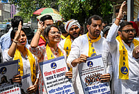 | Photo: PTI : Members of Association of Students for Alternative Politics (ASAP), student wing of AAP, stage a protest against the National Testing Agency (NTA) over the alleged paper leak concerns following the cancellation of the NEET-UG 2026 examination, outside the NTA office, in New Delhi.