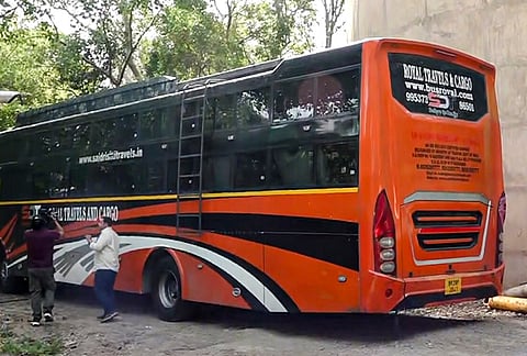 A private sleeper bus parked, in which a woman returning home from work in the Mangolpuri area was allegedly dragged and gang-raped by the driver and conductor, in New Delhi. The two men have been arrested. 