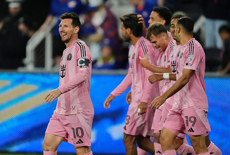 Inter Miami CF midfielder Lionel Messi, left, celebrates after scoring a goal during the second half of an MLS soccer game in Cincinnati. - | Photo: AP/Joshua A. Bickel