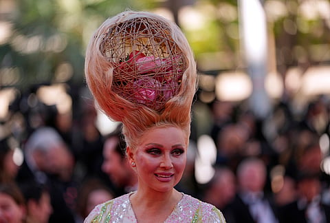 Elena Lenina poses for photographers upon arrival at the premiere of the film 'A Woman's Life' at the 79th international film festival, Cannes, southern France.