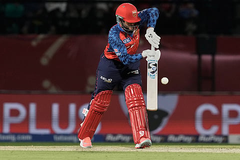 Punjab Kings' Azmatullah Omarzai plays a shot during the Indian Premier League cricket match between Punjab Kings and Mumbai Indians in Dharamshala, India.