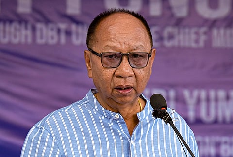 Manipur Chief Minister Yumnam Khemchand Singh addresses a programme for distribution of one-time grants to internally displaced college students under the Chief Minister's College Students Rehabilitation Scheme, at Imphal College.