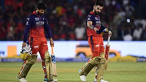 | PhotoL AP/Abhijit Addya : Royal Challengers Bengaluru's Virat Kohli, right, and batting partner Jitesh Sharma leave the field after winning the Indian Premier League cricket match between Kolkata Knight Riders and Royal Challengers Bengaluru in Raipur, India, Wednesday, May 13, 2026.