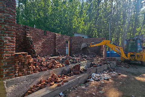 A joint anti-encroachment operation being conducted by District Administration and the police against a drug peddler as part of the ongoing crackdown against drug peddlers and illegal encroachments under the anti-drug campaign, at Chingam Frisal area, in Kulgam district, Jammu and Kashmir.