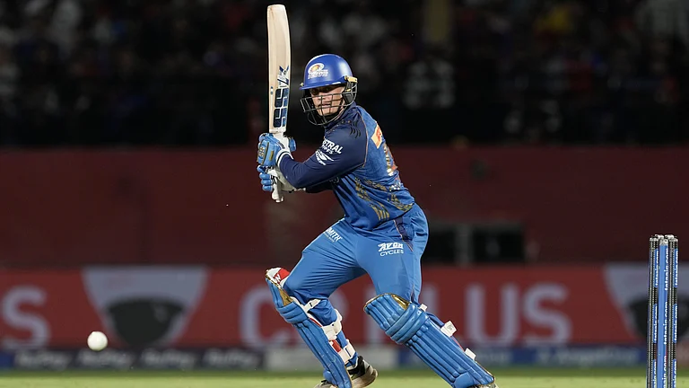 Mumbai Indians' Ryan Rickelton plays a shot during the Indian Premier League cricket match between Punjab Kings and Mumbai Indians in Dharamshala, India, Thursday, May 14, 2026 - (AP Photo/Ashwini Bhatia)