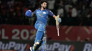 AP Photo/Ashwini Bhatia : Mumbai Indians' Tilak Varma celebrates after their win in the Indian Premier League cricket match against Punjab Kings in Dharamshala, India, Thursday, May 14, 2026.