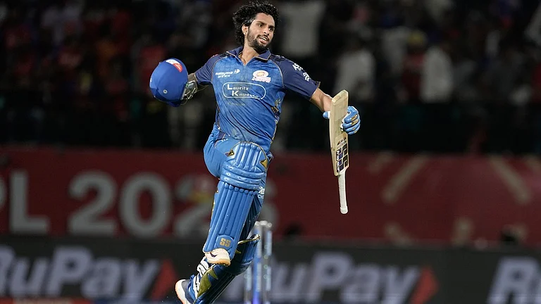 Mumbai Indians' Tilak Varma celebrates after their win in the Indian Premier League cricket match against Punjab Kings in Dharamshala, India, Thursday, May 14, 2026. - AP Photo/Ashwini Bhatia