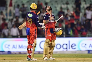 | Photo: AP/Abhijit Addya : Royal Challengers Bengaluru's Virat Kohli, right, reacts as his batting partner Jitesh Sharma llooks on after winning the Indian Premier League cricket match between Kolkata Knight Riders and Royal Challengers Bengaluru in Raipur.