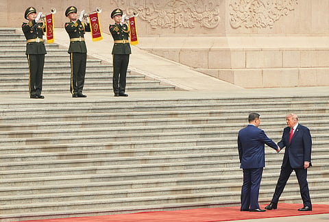 US President Donald Trump greets Chinese President Xi Jinping during a welcome ceremony at the Great Hall of the People in Beijing. 