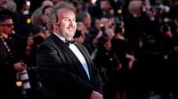 AP Photo/Andreea Alexandru : Peter Jackson poses for photographers at the opening ceremony and premiere of the film 'The Electric Kiss' during 79th international film festival, Cannes, southern France, Tuesday, May 12, 2026.