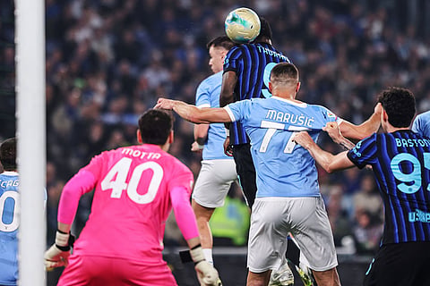 Inter's Marcus Thuram scores during the Italian Cup soccer final between Lazio and Inter Milan, in Rome.