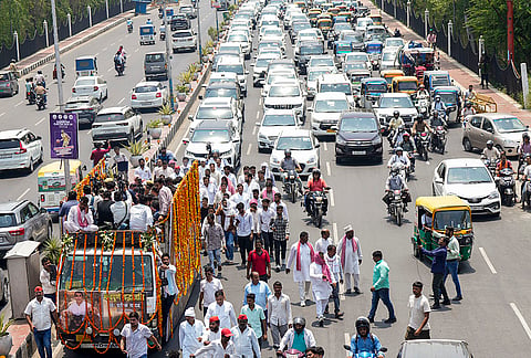 People take part in the funeral procession of Prateek Yadav, son of late Samajwadi Party patriarch Mulayam Singh Yadav, in Lucknow.