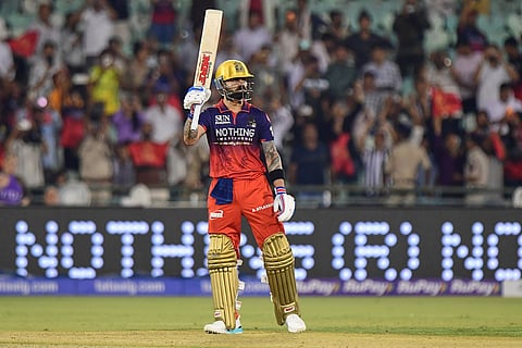 Royal Challengers Bengaluru's Virat Kohli celebrates his century during the Indian Premier League cricket match between Royal Challengers Bengaluru and Kolkata Knight Riders in Raipur, India.