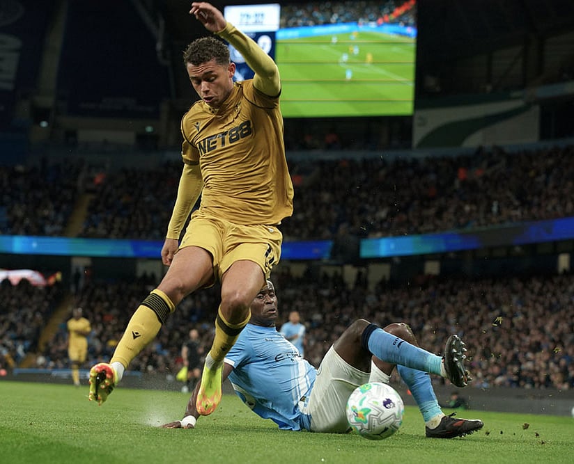 | Photo: AP/Ian Hodgson : Crystal Palace's Brennan Johnson, front, and Manchester City's Marc Guehi challenge for the ball during the English Premier League soccer match between Manchester City and Crystal Palace in Manchester, England.