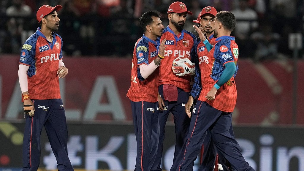 Punjab Kings' Yuzvendra Chahal, second left, celebrates with teammates the dismissal of Mumbai Indians' Rohit Sharma during the Indian Premier League cricket match between Punjab Kings and Mumbai Indians in Dharamshala, India, Thursday, May 14, 2026.  - AP Photo/Ashwini Bhatia