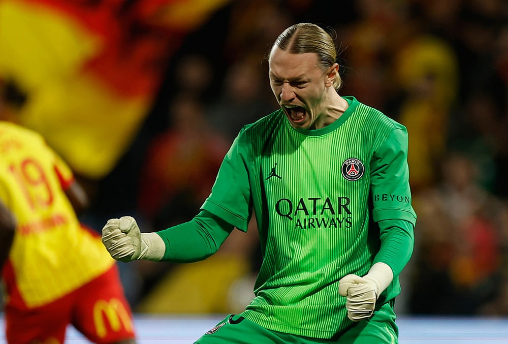 PSG's goalkeeper Matvey Safonov reacts after making a save during the French League One soccer match between Lens and Paris Saint Germain, in Lens, northern France. - | Photo: AP/Jean-Francois Badias