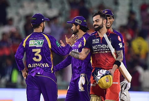 Royal Challengers Bengaluru's Virat Kohli, right, shake hands with Kolkata Knight Riders' captain Ajinkya Rahane after winning the Indian Premier League cricket match between Kolkata Knight Riders and Royal Challengers Bengaluru in Raipur.