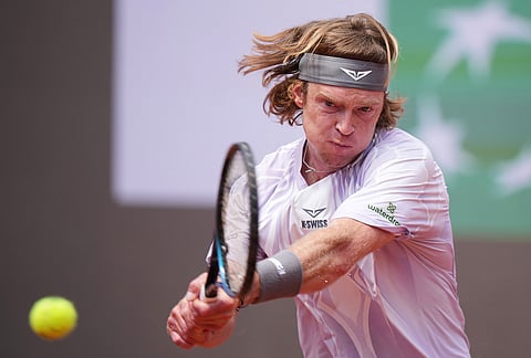 Andrey Rublev returns the ball to Italy's Jannik Sinner during their match at the Italian Open tennis tournament in Rome.
