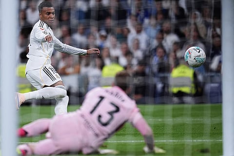 Real Madrid's Kylian Mbappe kicks the ball during the Spanish La Liga soccer match between Real Madrid and Real Oviedo in Madrid, Spain.