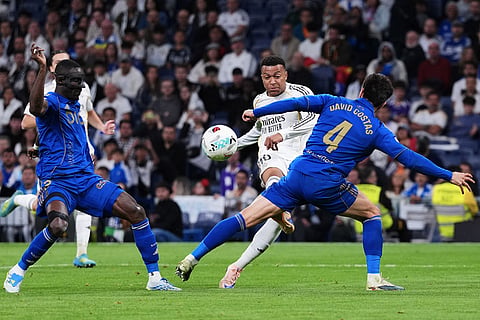 Real Oviedo's David Costas, front right, tries to block a shot from Real Madrid's Kylian Mbappe during the Spanish La Liga soccer match between Real Madrid and Real Oviedo in Madrid, Spain.