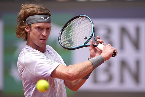 Andrey Rublev returns the ball to Italy's Jannik Sinner during their match at the Italian Open tennis tournament in Rome.