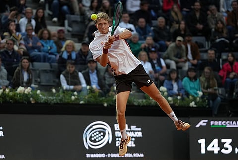 Spain's Martin Landaluce returns the ball to Daniil Medvedev, during their match at the Italian Open tennis tournament in Rome.