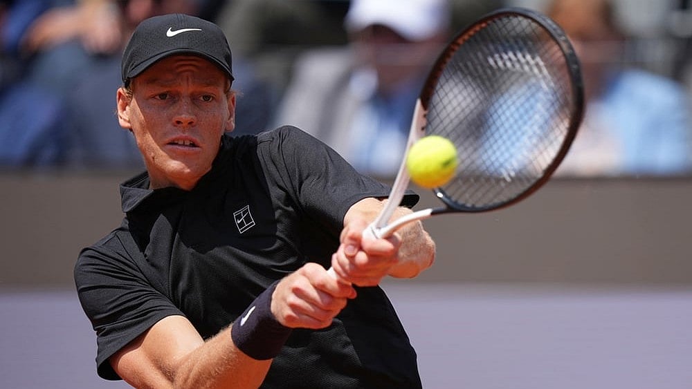 Italy's Jannik Sinner returns the ball to Andrey Rublev, during their match at the Italian Open tennis tournament in Rome. - | Photo: AP/Andrew Medichini