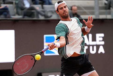 Karen Khachanov, of Russia, returns the ball to Casper Ruud, of Norway, during their quarter-final match at the Italian Open tennis tournament in Rome.
