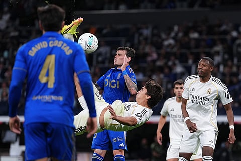 Real Madrid's Gonzalo Garcia kicks the ball during the Spanish La Liga soccer match between Real Madrid and Real Oviedo in Madrid, Spain.
