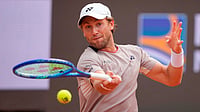 AP/Andrew Medichini : Casper Ruud of Norway returns to Luciano Darderi of Italy during their semi-final match at the Italian Open tennis tournament in Rome.