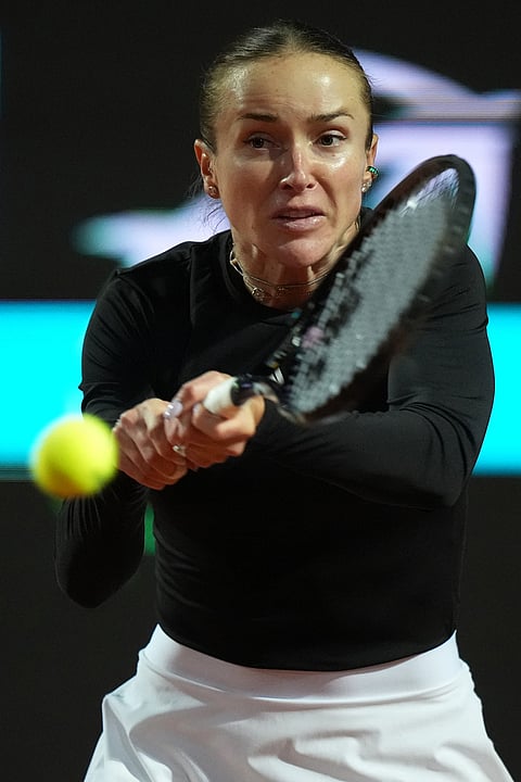 Ukraine's Elina Svitolina returns the ball to Poland's Iga Swiatek during their match at the Italian Open tennis tournament in Rome.
