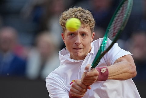 Spain's Martin Landaluce returns the ball to Daniil Medvedev, during their match at the Italian Open tennis tournament in Rome.