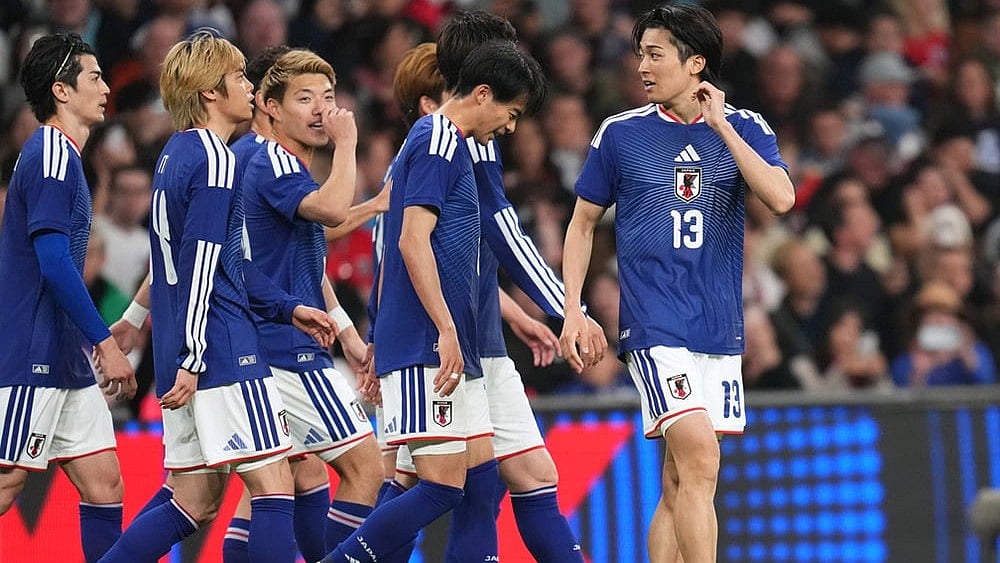 Japan players celebrate scoring their side's first goal during the International friendly soccer match between England and Japan in London. - | Photo: AP/Kirsty Wigglesworth