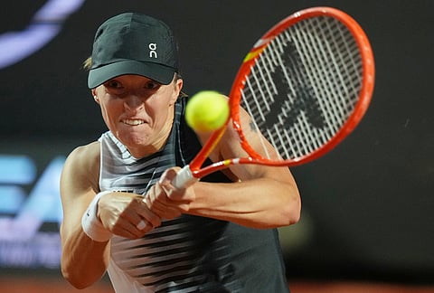 Poland's Iga Swiatek returns the ball to Ukraine's Elina Svitolina during their match at the Italian Open tennis tournament in Rome.