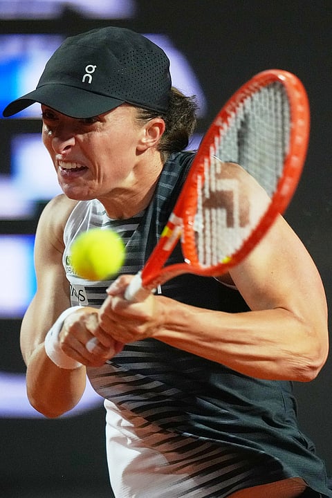 Poland's Iga Swiatek returns the ball to Ukraine's Elina Svitolina during their match at the Italian Open tennis tournament in Rome.