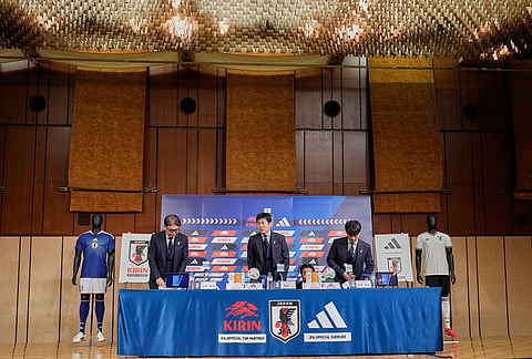 Masakuni Yamamoto, from left, national team director, Hajime Moriyasu, head coach of Japan's national soccer team, and Tsuneyasu Miyamoto, president of the Japan Football Association, prepare to attend a news conference announcing Japan's squad for the 2026 FIFA World Cup in Tokyo. 