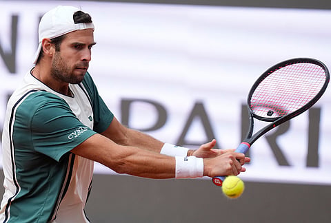 Karen Khachanov, of Russia, returns the ball to Casper Ruud, of Norway, during their quarter-final match at the Italian Open tennis tournament in Rome.