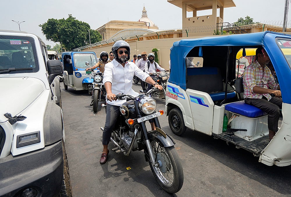 UP minister Danish Ansari rides a motorcycle