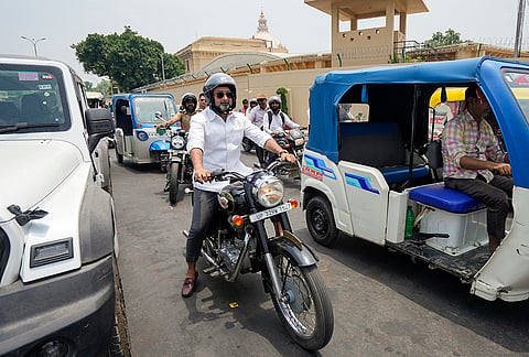 Uttar Pradesh Minister for Minority Welfare Danish Ansari commutes on a motorcycle, in Lucknow, Uttar Pradesh.