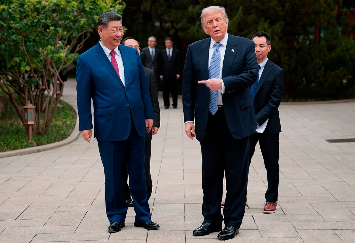  U.S. President Donald Trump gestures towards Chinese President Xi Jinping while leaving after a visit to the Zhongnanhai Garden in Beijing, Friday, May 15, 2026.  
 - Evan Vucci