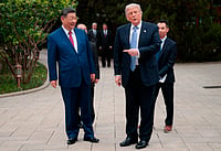 Evan Vucci :  U.S. President Donald Trump gestures towards Chinese President Xi Jinping while leaving after a visit to the Zhongnanhai Garden in Beijing, Friday, May 15, 2026.  
