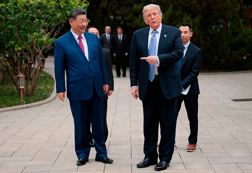 U.S. President Donald Trump gestures towards Chinese President Xi Jinping