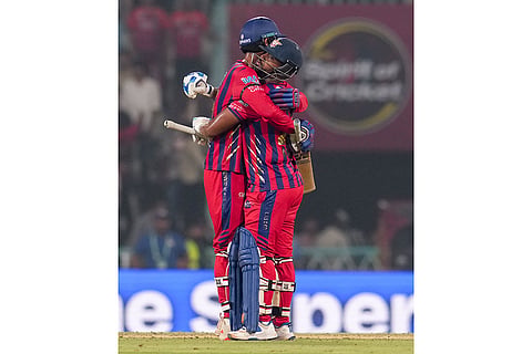Lucknow Super Giants' Mukul Choudhary, left, and Nicholas Pooran celebrate after winning an Indian Premier League (IPL) 2026 T20 cricket match between Lucknow Super Giants and Chennai Super Kings, in Lucknow, Uttar Pradesh.
