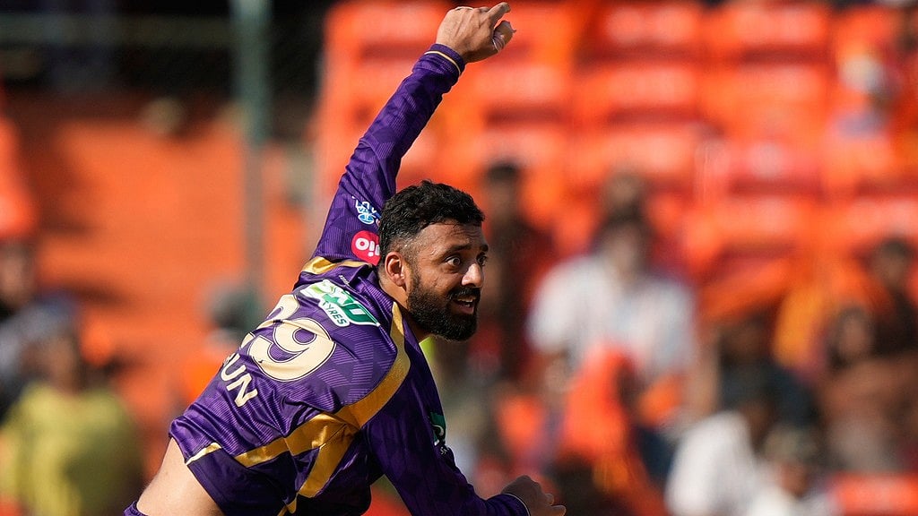 Varun Chakravarthy bowls a delivery during the Indian Premier League match between Sunrisers Hyderabad and Kolkata Knight Riders in Hyderabad. - AP/Mahesh Kumar A.